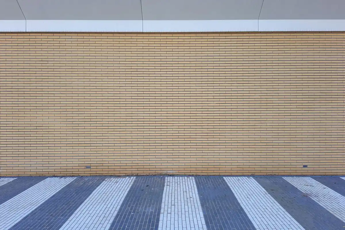 After: Main wall section — spalling brick removed and replaced with matched clay brick units