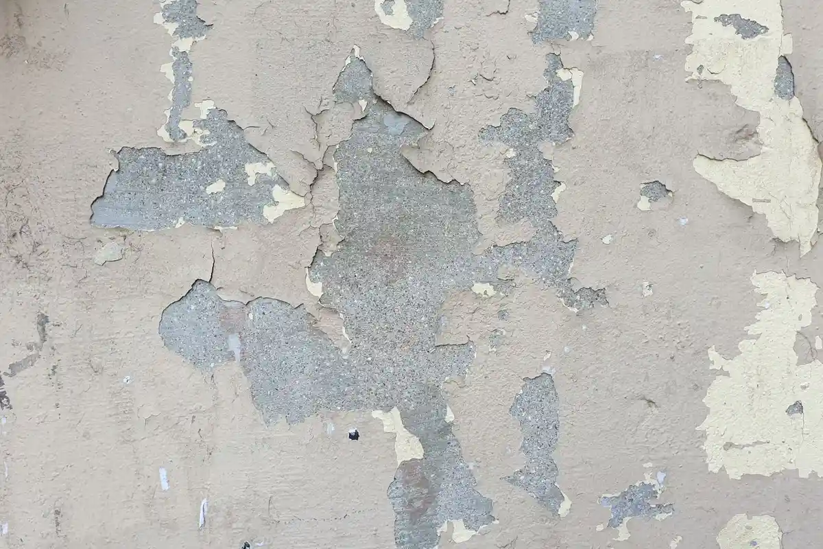 Before: Main wall section — spalling brick removed and replaced with matched clay brick units