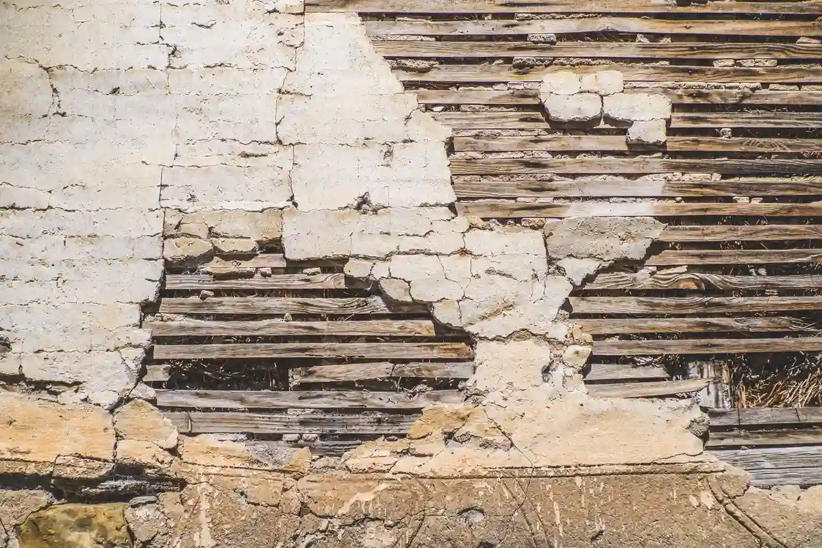 Before: Front facade — deteriorated brick replaced with color-matched full-bed clay brick