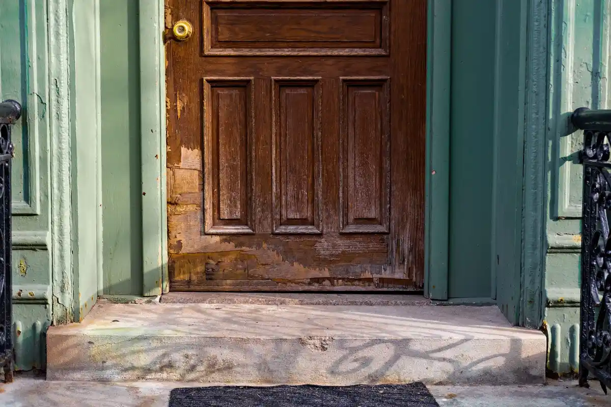 After: Front wall — natural stone veneer installed over drainage mat with back-butter mortar