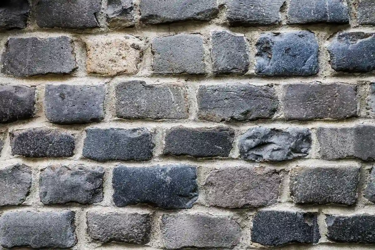 Before: Main facade — failed mortar joints removed and replaced with Type S color-matched mortar