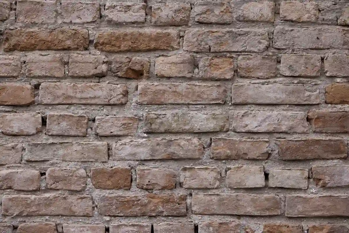 After: Stack exterior — spalling brick removed, matched replacements installed with fresh mortar