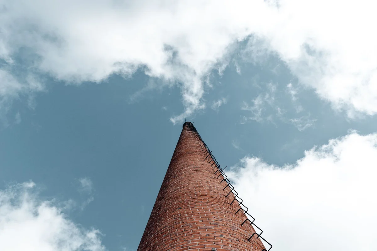 Before: Stack exterior — spalling brick removed, matched replacements installed with fresh mortar