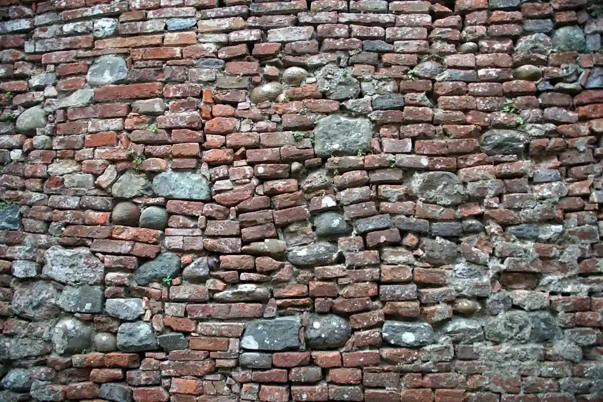 Before: Chimney section — deteriorated mortar repointed and sealed against water infiltration