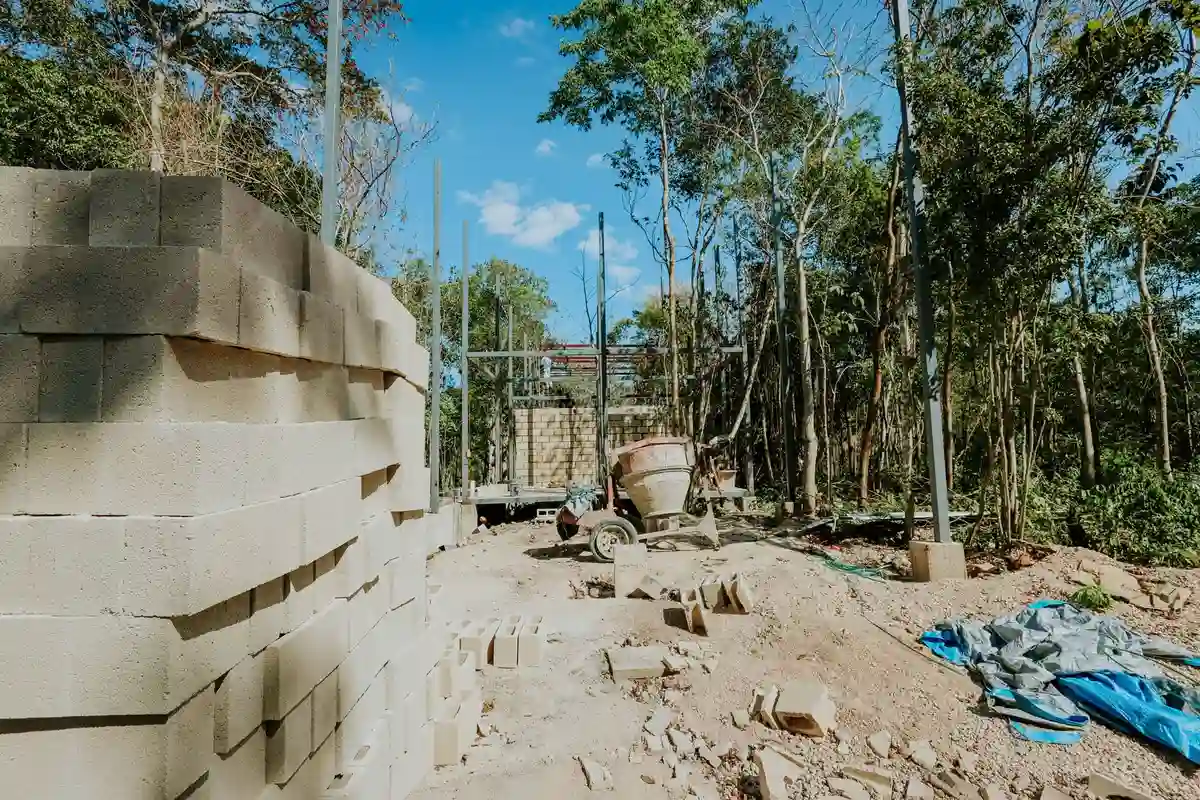 Before: Foundation section — CMU foundation wall built to code with full grouting and drainage