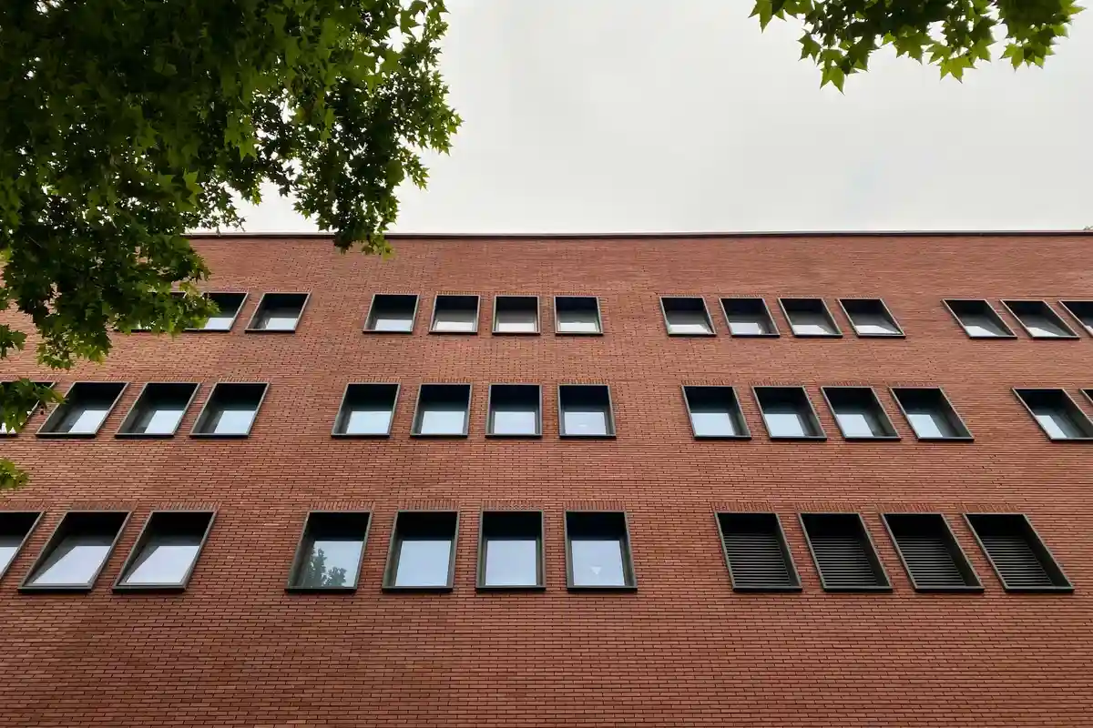 After: Main facade — original failing commercial brick restored and matched across full elevation