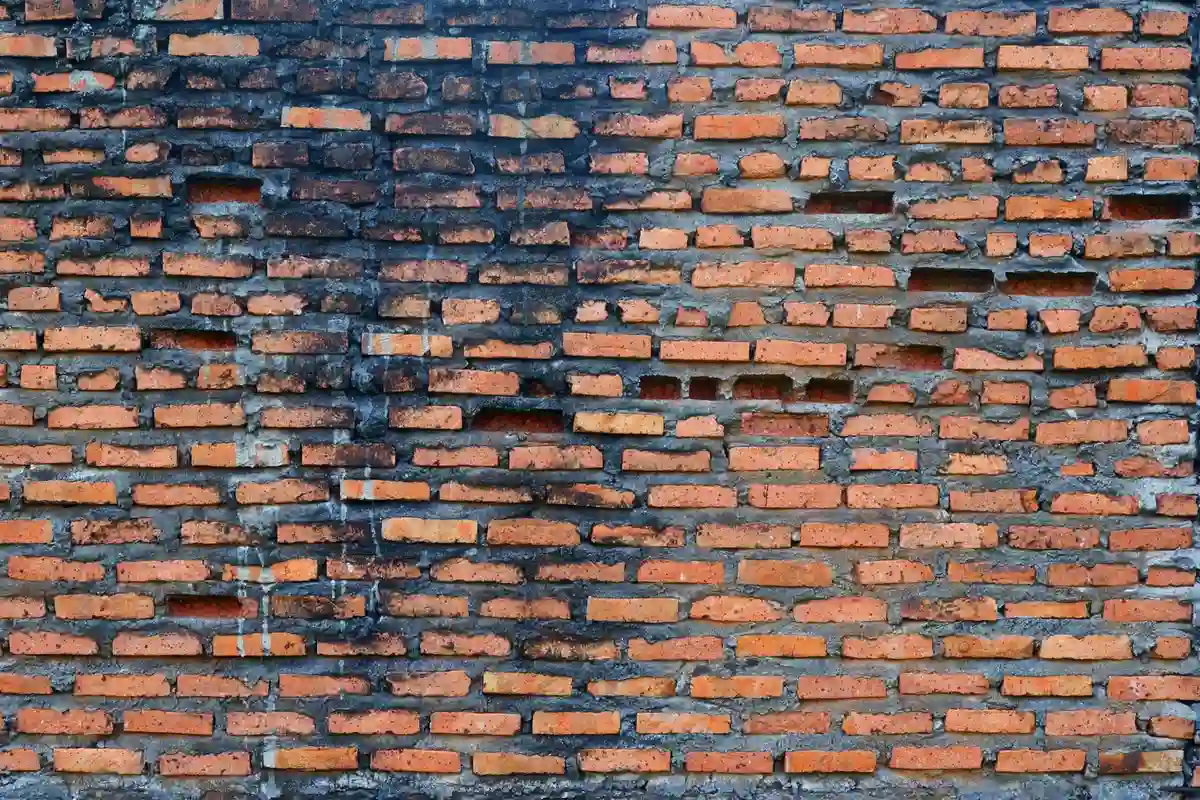 Before: Main facade — failed mortar joints removed and replaced with Type S color-matched mortar