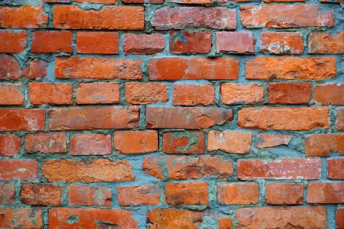 After: Side elevation — complete brick installation with proper wall tie placement