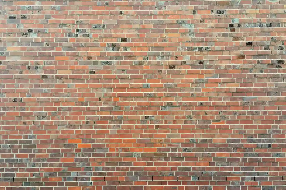 After: Entry wall — mortar-matched joints with consistent tooling profile throughout