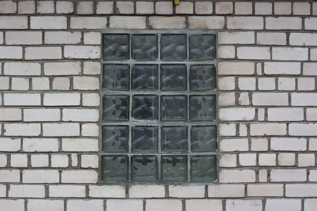 After: Retaining wall — CMU block installed with vertical rebar and grout consolidation throughout