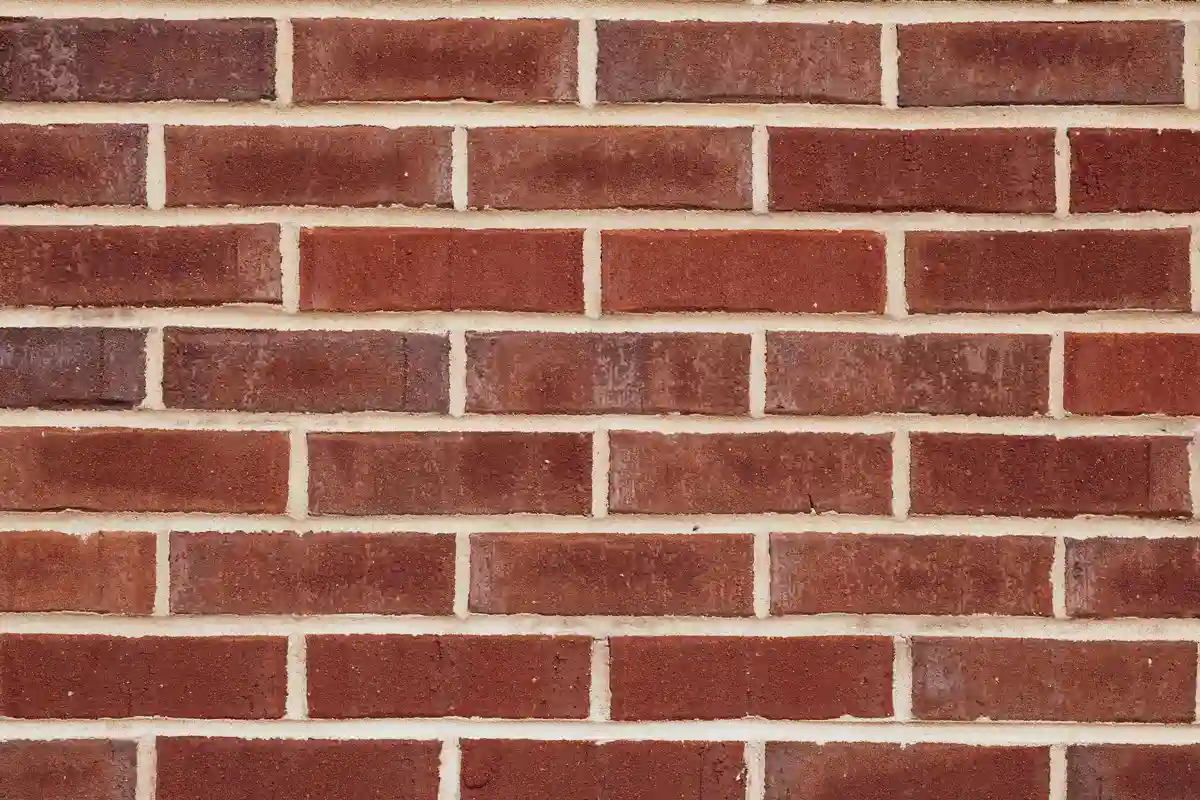 Before: Main facade — failed mortar joints removed and replaced with Type S color-matched mortar