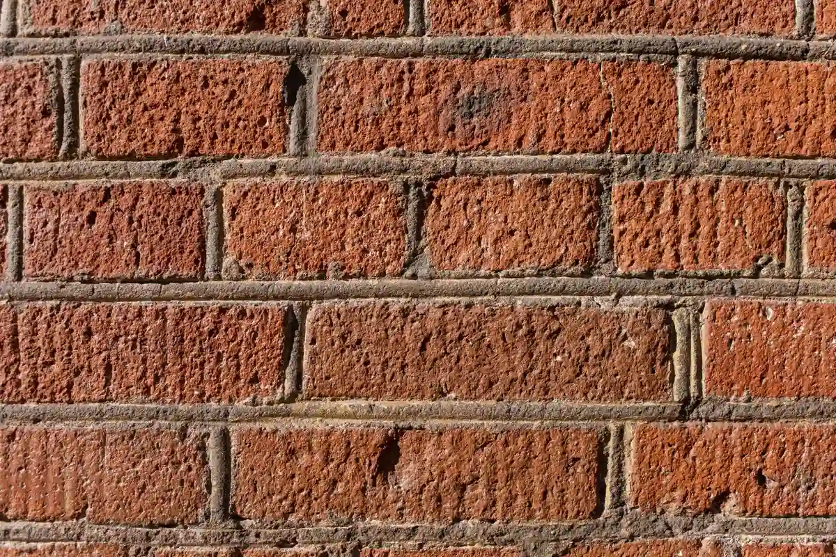 Before: Chimney section — deteriorated mortar repointed and sealed against water infiltration