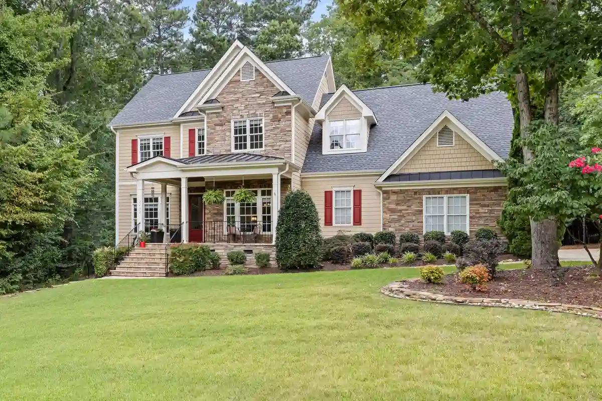 After: Entry surround — custom limestone arch and columns installed with precision alignment