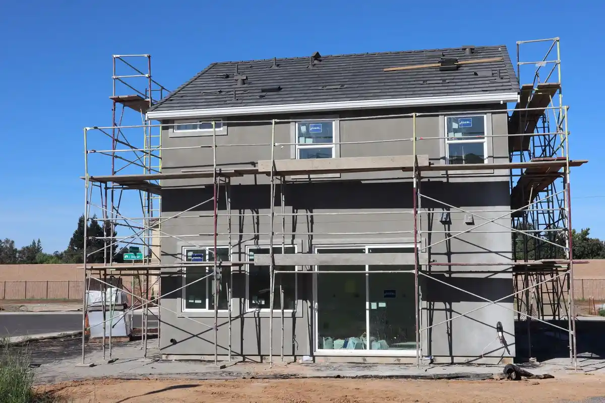Before: Window surrounds — limestone sills and lintels installed flush with consistent mortar profile