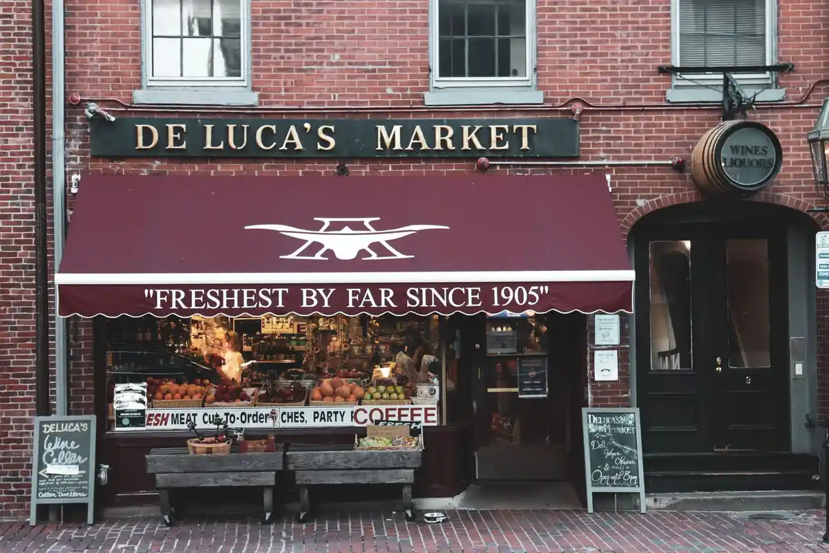 After: Storefront surround — original stone trim cleaned, repointed, and sealed