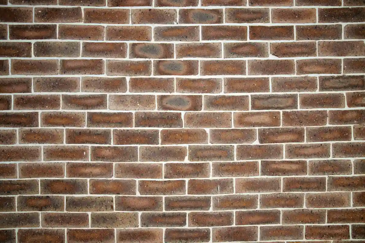 After: Entry wall — mortar-matched joints with consistent tooling profile throughout