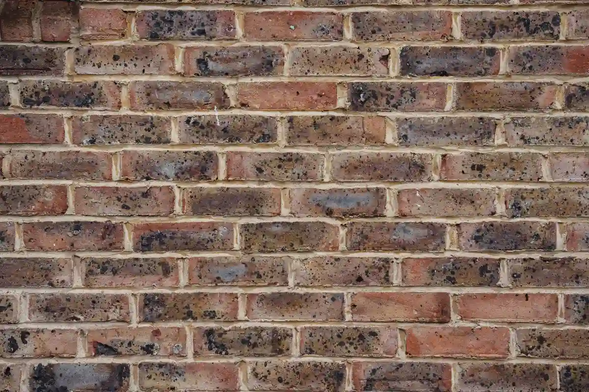 Before: Chimney section — deteriorated mortar repointed and sealed against water infiltration