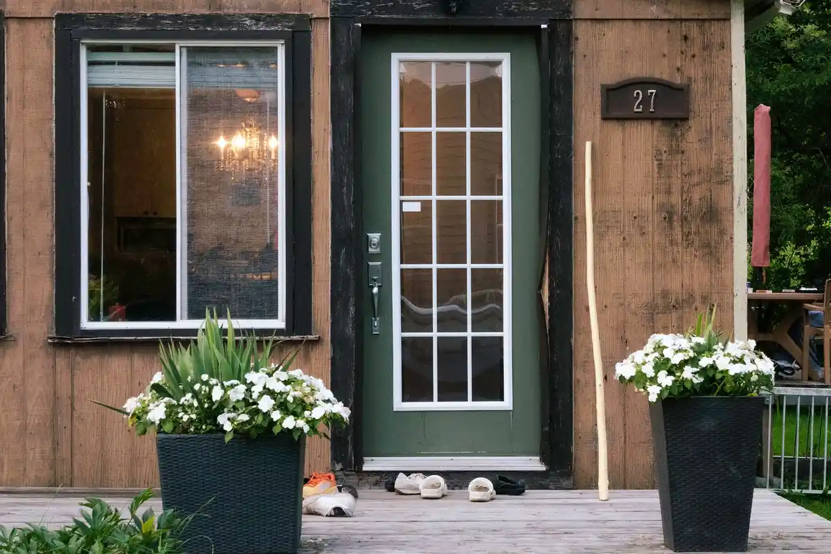 After: Front wall — natural stone veneer installed over drainage mat with back-butter mortar