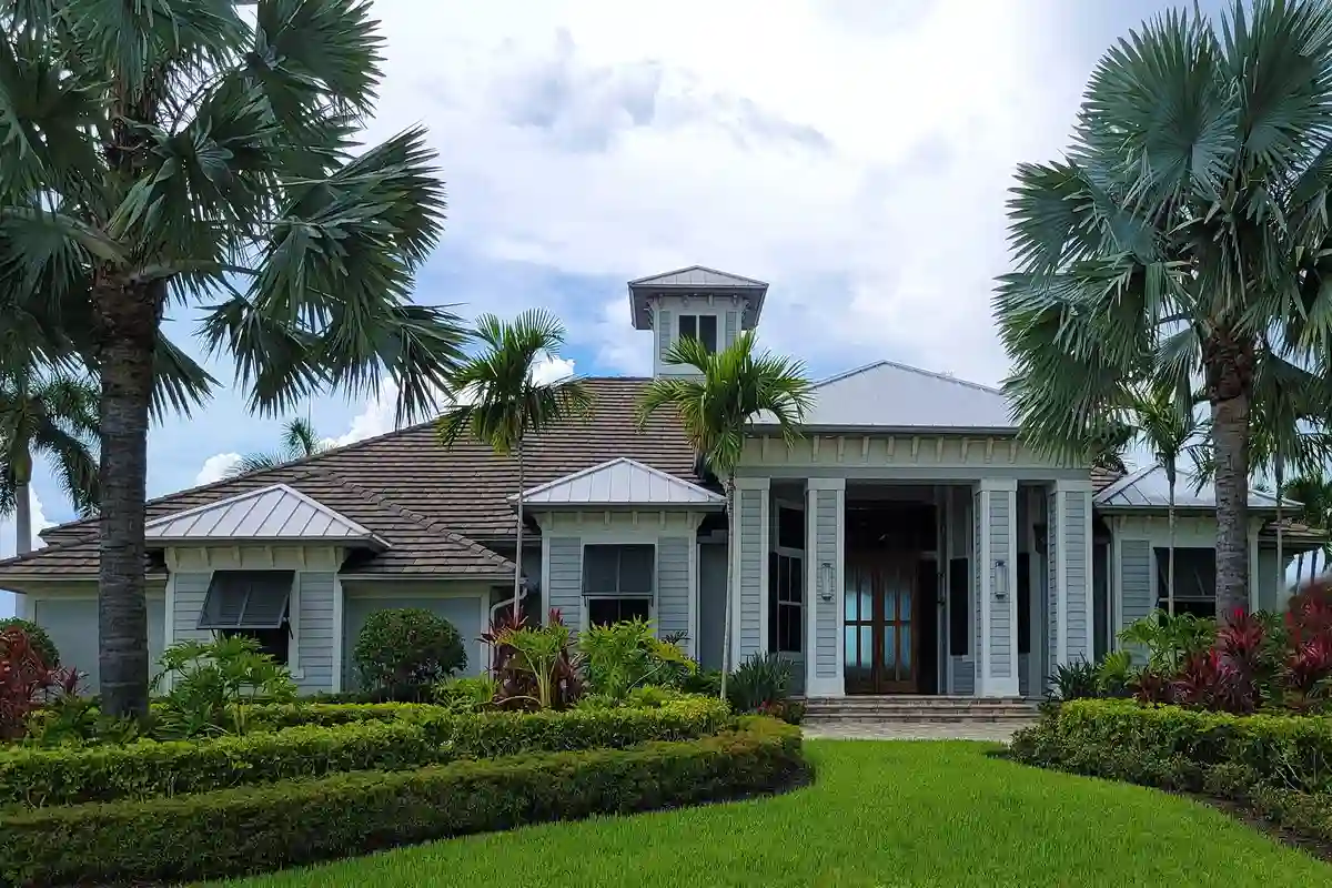After: Primary facade — full exterior brick and limestone installation from foundation to roofline