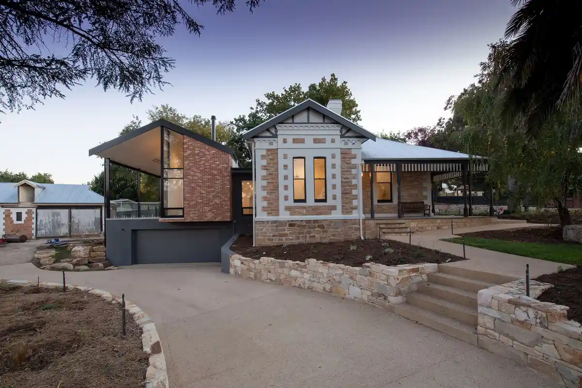 After: Entry surround — stone veneer accent columns and arch installed with matching mortar