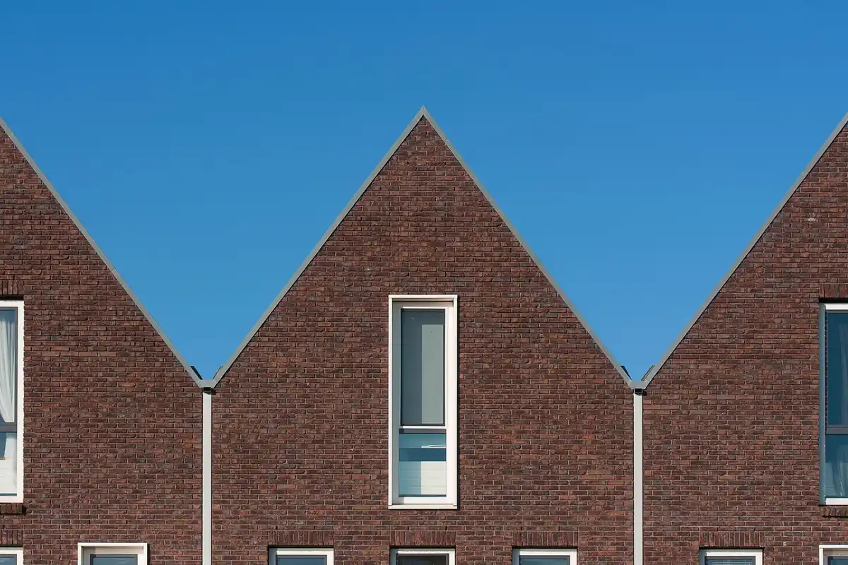 After: Front facade — deteriorated brick replaced with color-matched full-bed clay brick