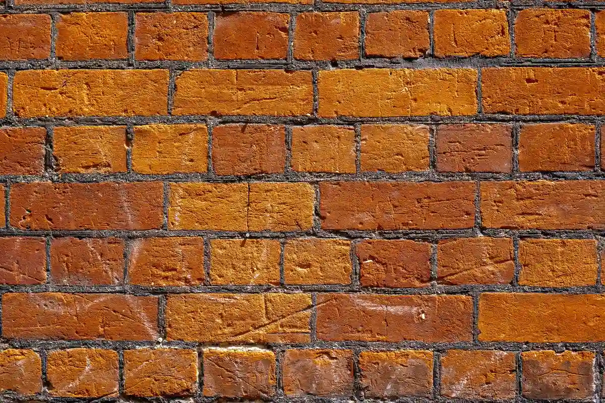 Before: Entry wall — mortar-matched joints with consistent tooling profile throughout