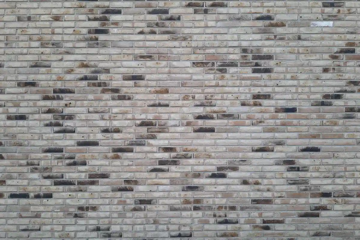After: Main facade — failed mortar joints removed and replaced with Type S color-matched mortar